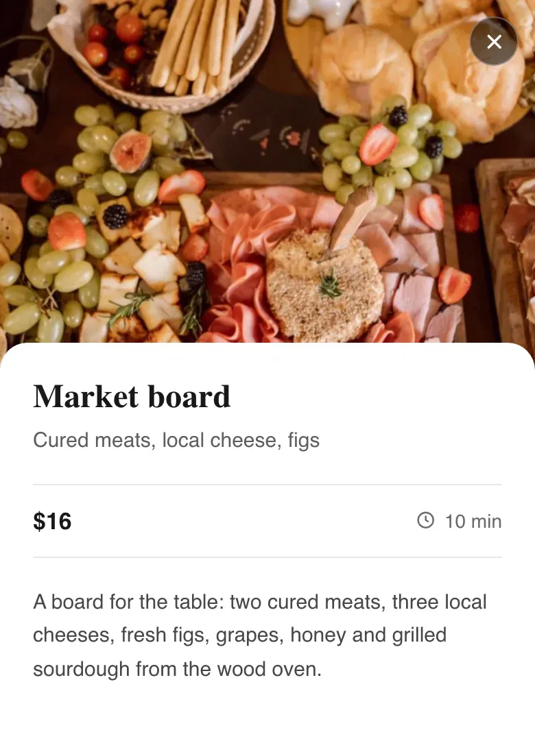 A dish detail on a phone with a photo, name, price, cook time and a longer description
